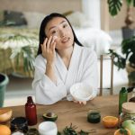 Beautiful asian woman preparing homemade cream with natural ingredients for skin care