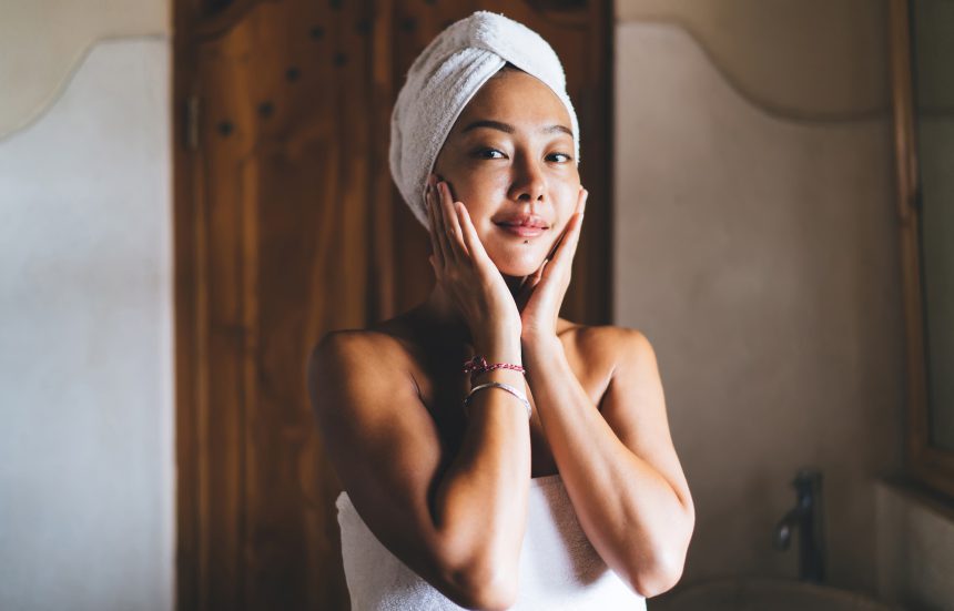 beautiful woman doing routine cosmetology procedures in home interior