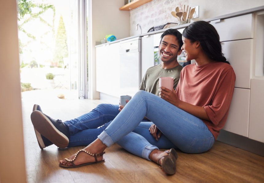 Couple communication, love with coffee in the kitchen and happy together to bond in the morning. Ma