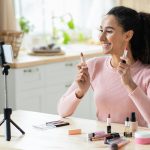 Makeup Trends. Smiling Attractive Female Recording Video Content For Her Beauty Blog